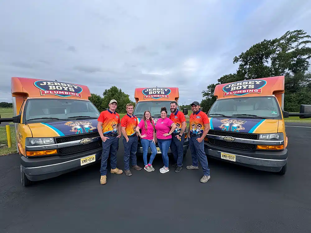 The Jersey Boys team in front of their truck fleet.